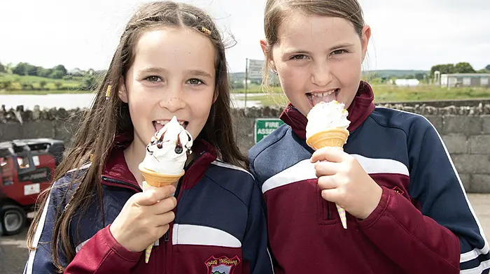 Catherine Foley and Ruby Hurley enjoying some ice cream at Timoleague National School’s celebration day.  (Photo: Martin Walsh)