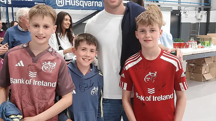 Darragh O'Connor, James Buckley and Evan O'Driscoll from Muskerry RFC with Munster and Ireland rugby star Jack Crowley at the opening of the new Atkins showroom in Bandon on Saturday June 14th.