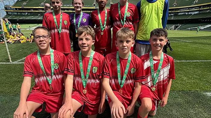 Rath National School’s sixth class boys did the community proud by reaching the FAI soccer final at the Aviva where they finished in third place in their group. Back: Ben Pitton Brady, Tadhg Ronan, Kingsley Crosby, Senan Whooley and Shane Hallihane (coach). Front: Jesse Best, Theo Best, Fionn Daly and Paddy Sheehy (captain).