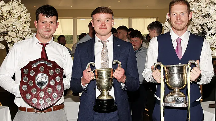Leading the team parade to the function room with the three trophies won last year were, Tadhg Cullinane, Padraig Reidy and Ronan Kennedy.