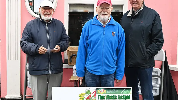 Regular supporter of the Clonakilty Rugby Club lotto Tom Kirby (centre) with club lotto officers Denis Noonan (left) and Jimmy O'Regan at their usual location outside O'Donovan's Hotel, Pearse Street on Friday mornings. (Photo: Martin Walsh)