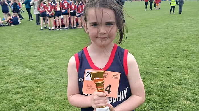 Indie O'Sullivan of Carrigboy National School with the trophy she won at Cork City Sports last week.