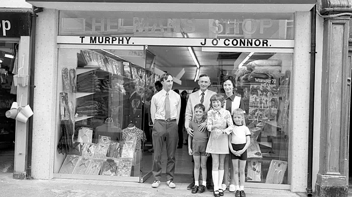 Johnny O'Connor, and Tommy Murphy and family outside the Man's Shop, 1972.