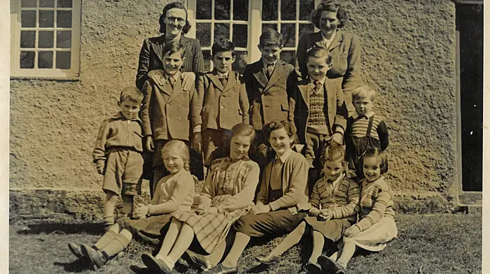 Curravarahane National School. Back row (from left): Mrs Hawkes (teacher), and Mrs Good. Middle row (from left): Herbie Jennings, Ray Good, Robin Jennings, John Jennings, Fergus Appelbe, and Frank Good. Front row (from left): Iris Good, Kay Loane, Marion Jennings, Betty Jennings and Harriette Loane.  c1950.
