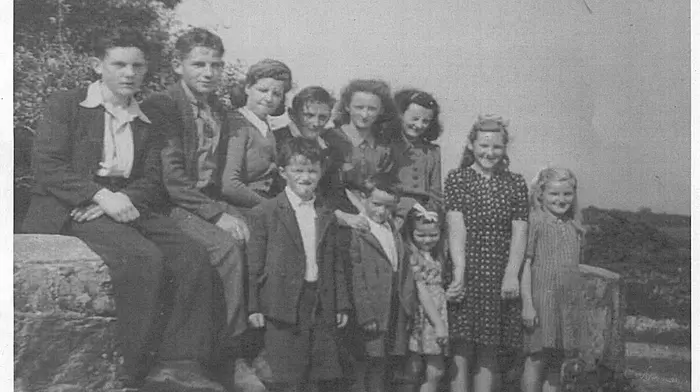 Sitting on Maggie Kelleher's Bridge in Ballinascarthy are Andy Kelleher, Pat O'Donovan, Joan Kelleher, Jackie Kelleher, Judy McCarthy, Kitty McCarthy.Standing (from left): Johnny Nyhan, Tommy Nyhan, Mary Kelleher, two other children unknown.