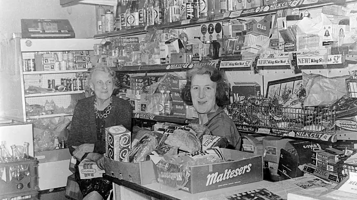 May Berry and Kathleen Crowley catching up on the events of the day in Kathleen's shop 'The Favourite' on Bridge Street, Skibbereen in 1979. (Photo: Michael Minihane)