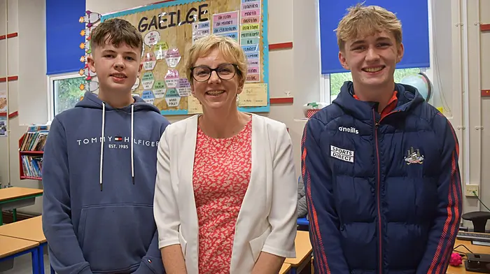 Left: Elaine and Noah Shanahan from Rosscarbery. Above: Anne McCarthy, Principal Ardagh Boys NS with former pupils John Harte and Tom Browne. Photos: Andy Gibson & Anne Minihane)