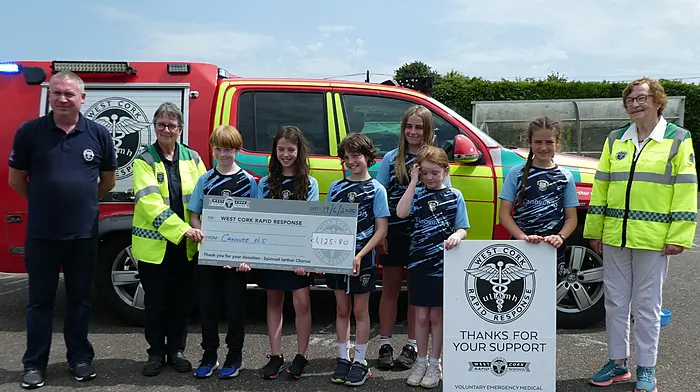 Student council members from Canovee National School handing over the proceeds of their very successful bake sale to West Cork Rapid Response; Liam Slattery (WCRR), Kate Crowley (WCRR), Éanna McCarthy, Aoife O'Driscoll, Caoimhe Nash, Anna O'Sullivan, Méabh Harrington, Máire O'Donovan and Betty Hennessy (WCRR).
