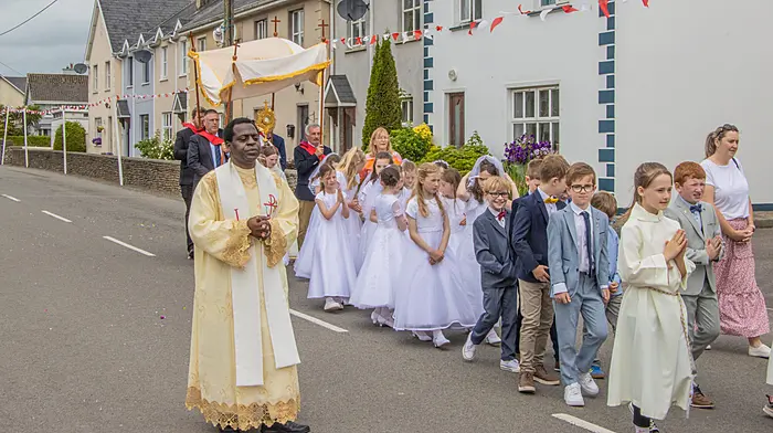 Fr Emmanuel assisting Fr Pontianus Jafla in Kilbrittain as the Corpus Christi procession headed through the streets of Kilbrittain to the grotto at the end of the village where the church choir performed for those in attendance.
