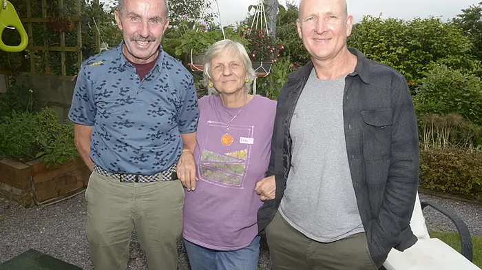 NEWS 29/6/2025 Pictured at an open garden family day fundraiser at Pinetree Lodge Garden and Gallery was Sean O'Donovan, Erika Sexton and Brendan McCarthy. Picture Denis Boyle
