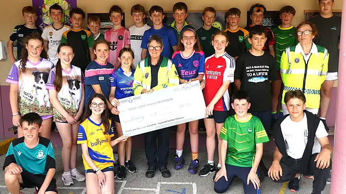 A very colourful sixth class from Kilmurry National School handing over their donation to Kate Crowley and Betty Hennessy of West Cork Rapid Response, the proceeds from their very successful jumble sale which everyone really enjoyed.