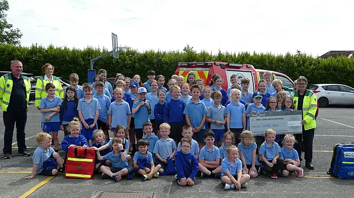 The pupils from Scoil Lachtaín Naofa in Cillnamartra who held a no uniform day and a bake sale to raise funds for the West Cork Rapid Response. They presented the proceeds to Liam Slattery, Betty Hennessy and Kate Crowley of WCRR during their recent visit.