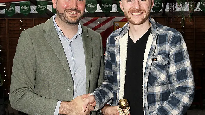 Senator Noel O'Donovan presents the Players' Player of the Year to Chris Collins.