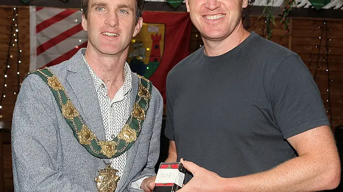 Mayor of Clonakilty Conan O'Donovan presents medals to the Clonakilty Soccer Club goalkeeper Iain O'Driscoll.