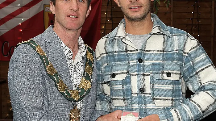 Ethan Draper receives his medals from the Mayor of Clonakilty Conan O'Donovan.