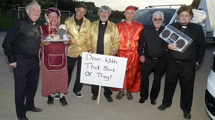 NEWS 12/7/2025 Pictured at the Bailiú na Banndan Summer festival was John O'Donovan, Roy Collins, David McSweeney, Fergus Moynihan, Aidan Glavin, Der O'Donovan and Steve Kelly as Fr Ted. Picture Denis Boyle