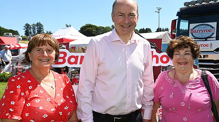 An Taoiseach Micheál Martin at the 67th Barryroe Show in Pairc Uí Mhurchú, Barryroe with Ann Murphy (left) and Ailish Crisp. The Barryroe GAA complex is named after Ann's late husband Paddy, while Ailish returns from England each year to attend the show.   (Photo: Martin Walsh)