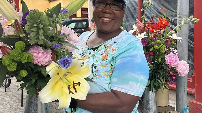 Lilian Murphy with a cheerful bouquet she had picked from her own garden for her flower stall at Bantry market on Friday.