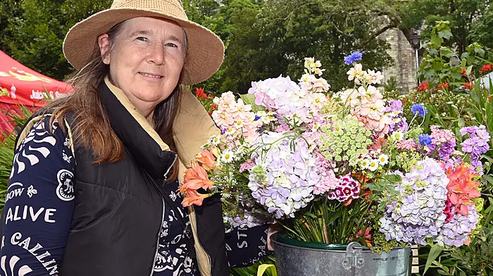 Joanna Wood with her flowers at the Friday market.  (Photo: Martin Walsh)
