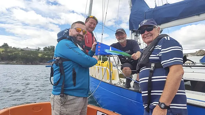 Schull’s ex postmaster, Thomas Newman, is setting off on a big adventure to satisfy his wanderlust and love of sailing. Everyone wishes him well and safe passage as he sails to the Azores in his beloved Contessa 32, Sitelle.  Thomas has planned for months and the stars have aligned with fair weather for his solo voyage south.  Mark Murphy, John McGowan and John Molloy of the SHSC went out in the club tender to present Tom with a club burgee before he weighs anchor.