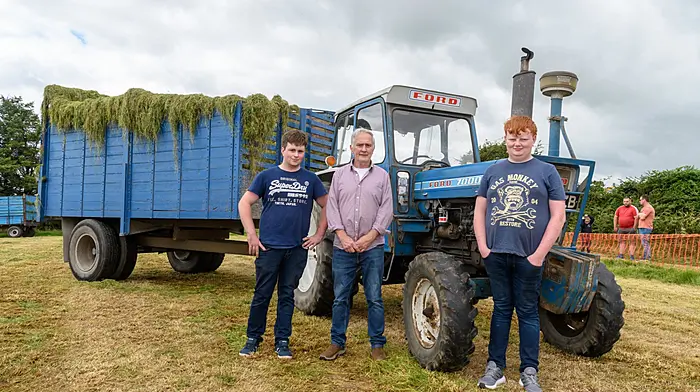 Jack, John and Cathal Tobin (The Pike) with their 1975 Ford 7000 which has been drawing silage for the family for 50 years. It was drawing silage again at The West Cork Vintage Ploughing & Threshing Association’s vintage harvest day at The Pike, Clonakilty. Proceeds from the event will go to Down Syndrome Cork, Field Of Dreams, Marymount Hospice and Bandon AFC and GAA All-Stars.  (Photo: David Patterson)