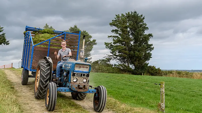 Simon Jennings (Enniskeane) heading to the pit with a Ford tractor and trailer at the vintage harvest day in The Pike which was hosted by the West Cork Vintage Ploughing & Threshing Association.  (Photo: David Patterson)