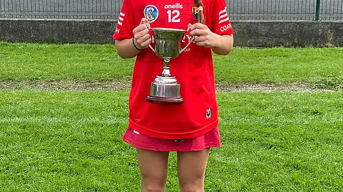 Ellen Foley with the Munster Camogie Blitz cup won by the Cork under 15 team.