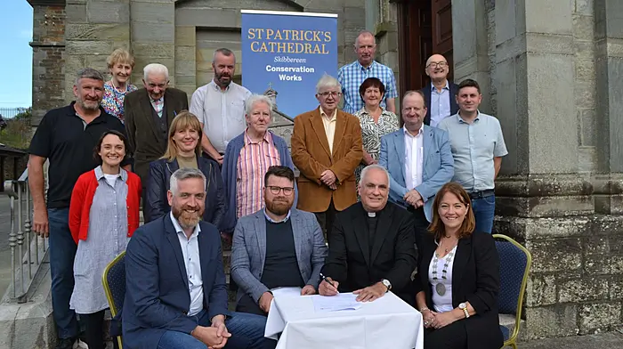 Signing the contract for the start of the restoration works at  St Patrick's Cathedral in Skibbereen were Christopher O'Sullivan TD Minister for State at the Department of Housing, Local Government and Heritage, James Byrne of Southgate Associates, Fr Kevin O'Regan, Cllr Caroline Cronin, Deputising for Cork County Mayor. Also attending were Michael Collins TD, county councillors Isabel Towse, Brendan McCarthy, Daniel Sexton, and committee chairman Michael Dwyer, committee secretary Helen Dempsey, Joe Downing of Downing Construction Ltd, Triona Arundel of Southgate Associates, sacristian Bernie Kelly, Eileen O'Sullivan, Gerald O'Brien, June Kelly and Denis O'Driscoll. Photo: Anne Minihane..