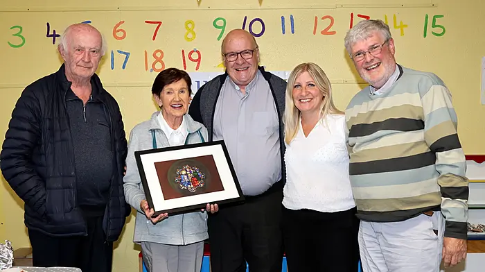 Fr Terry O'Brien MSC (centre) receiving a presentation from Peg Collins, Church Cross, to mark the end of his term as Co-PP Aughadown. Included also are Fr Donal Cahill, Mary Lou Leahy and Fr Bernard Cotter.