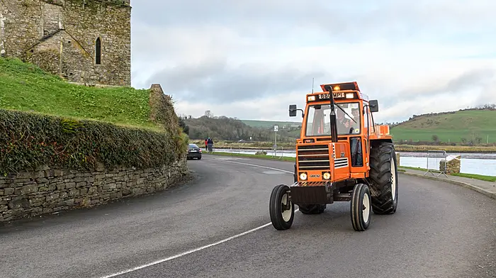 John Harrington with grandson Aaron(both Ballinhassig) drove a Fiat 880 tractor, seen here at the Kilbrittain tractor run passing through Timoleague at the abbey. Proceeds of the run will go towards a state of the art residential centre for autistic adults on the outskirts of Dunmanway.Picture: David Patterson, Tractor Run – Cork