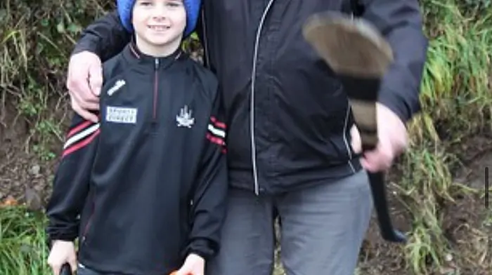 JK Coleman, with his grandson Tommy O'Sullivan, enjoying a day out at Ballinhassig’s Poc Fada.