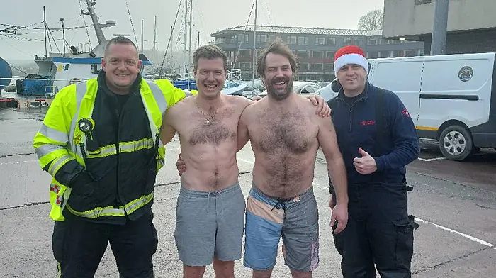 Two members of Kinsale Fire and Rescue braved the elements on Christmas Day for the annual Kinsale Lions Christmas swim. From left: Ger Butler, Cian O'Donoghue, David Quinn and sub officer Duane Steenson.