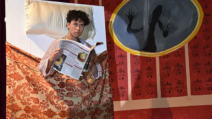 Schull Community College Transition Year student Damian Williams as Scrooge, reading a supplement from The Southern Star in the SCC panto “A Christmas Carol”