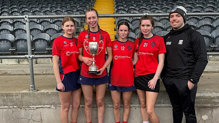 Newcestown camogie club members on the winning Munster final team at Coláiste na Toirbhirte last weekend were (from left): Róisin Wilson, Sarah Burrows, Karen O'Sullivan and Rachel Crowley with their coach Luke Meade.