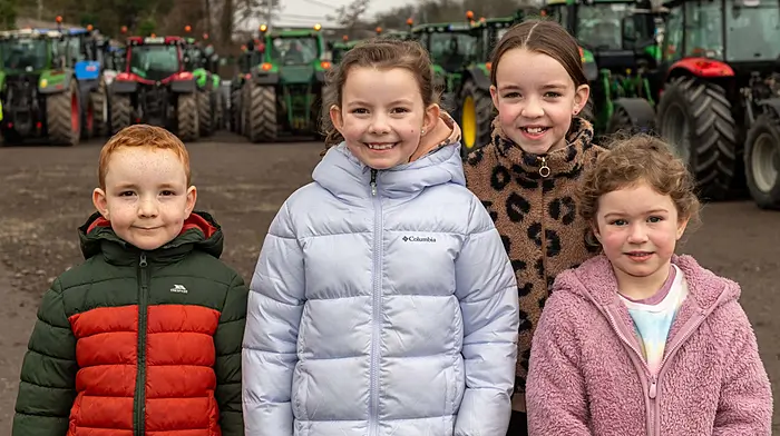 Enjoying looking at the assembled tractors were Cathal; Anna and Emma Keohane and Chloe Kingston, all from Bandon. (Photo Andy Gibson)