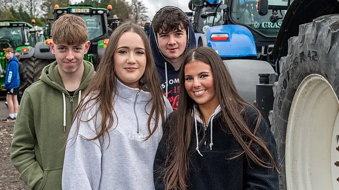 Enjoying looking at the assembled tractors were Jack Murphy, Crossbarry; Caoimhe O'Mahony, Riverstick; Evan O'Leary, Crossbarry and Lauren Crowley, Ballinhassig. (Photo Andy Gibson)