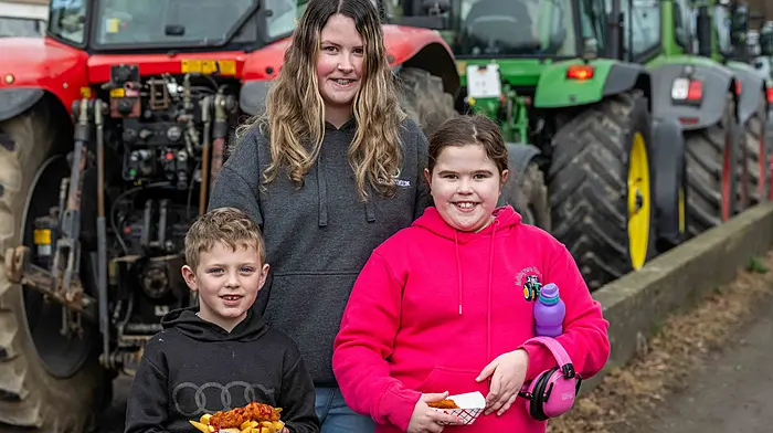 Enjoying looking at the assembled tractors at the Bandon tractor run were Diarmuid; Chloe and Elle Crowley from Bandon. (Photo Andy Gibson)