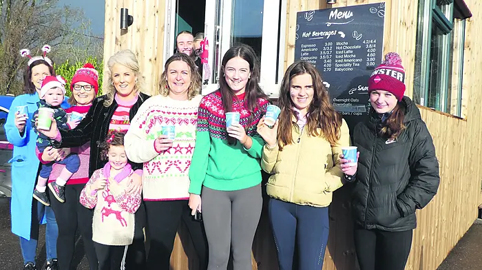 Enjoying their coffee at Ballinascarthy's newest business venture, BalBrú,  are (from left): Michelle Murphy, Tadhg O'Flynn, Therese O'Flynn, Grace Hanrahan, Freya Hanrahan, Louise O'Callaghan, Aideen Murphy, Ayla Bishop and Neasa Kiernan with Millie Condon and Kate O'Donovan busy at the hatch.
