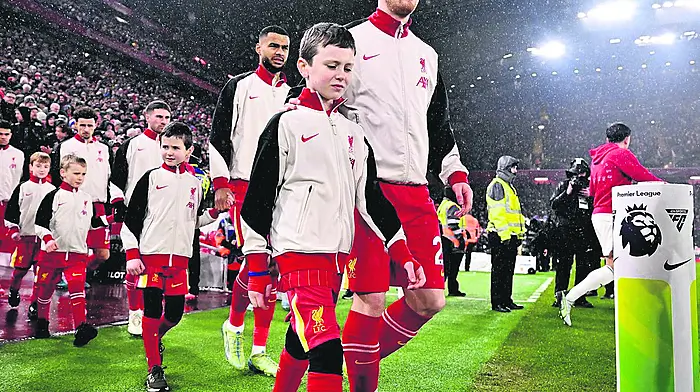 Evan Dineen paired up with Andy Robertson and his brother Ryan escorted Dutch international Cody Gakpo onto the pitch at the recent Liverpool Football club versus Man United clash at Anfield.