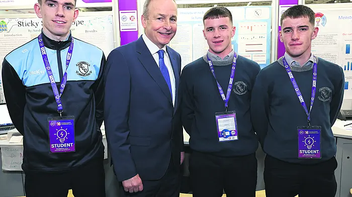 Tánaiste Micheál Martin with Andrew McCarthy, Éanna Déiseach and Flor McCarthy from Clonakilty Community College with their project Imscrúdú ar na Buntáistí a Bhaineann le Tumadh Uisce Fuair at the 61st BT Young Scientist & Technology Exhibition at the RDS Dublin. (Photo: Damien Eagers)
