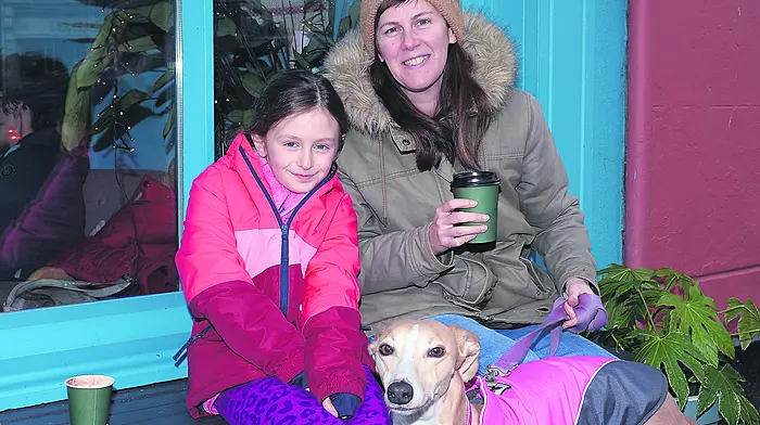 Locals Esme Walsh (left) and Alexis McKee with their dog Pumpkin out and about in Clonakilty.  (Photo: Martin Walsh)