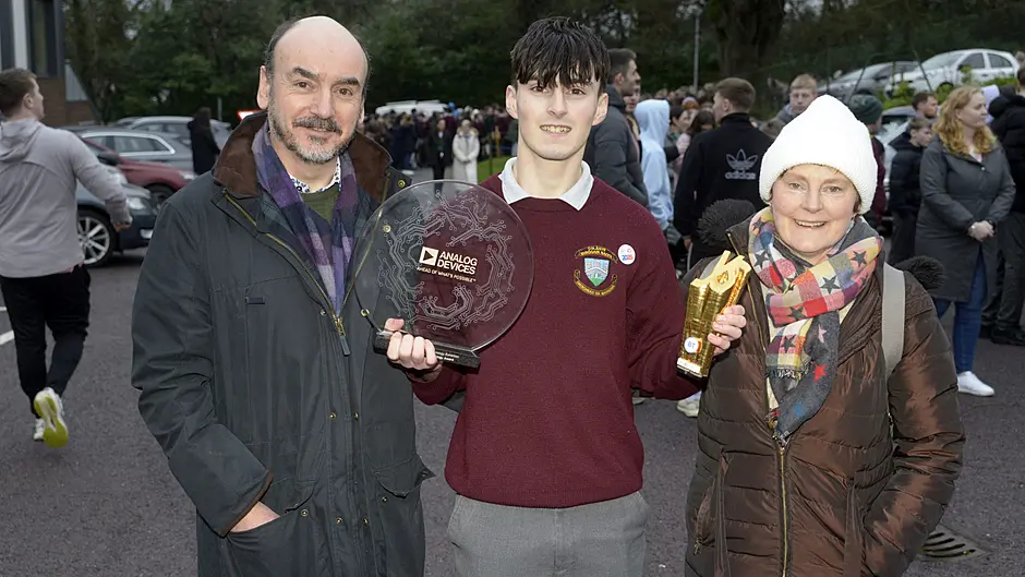 Tomás Markey back at St Brogan's College in Bandon with parents Colin and Siobhan with his award for best individual  at the BT Young Scientist of the Year. (Photo: Denis Boyle)