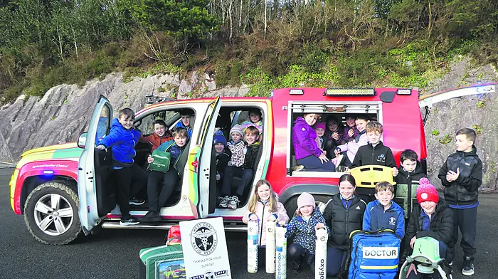 Pupils from Scoil Réidhna nDoirí exploring the West Cork Rapid Response jeep on its recent visit to their school.
