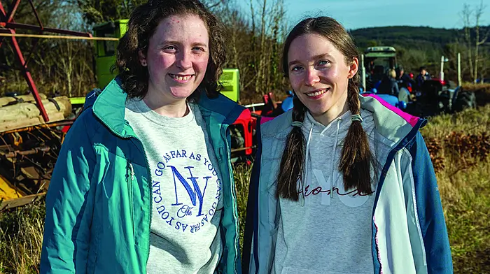 Rwins Gráine & Helena O'Driscoll from Lackaghane at the annual Rath Vintage Club threshing day, held in aid of local charities. Right: 6-year-old Annie Casey from Baltimore enjoying her day out at the threshing. (Photo: Andy Gibson)