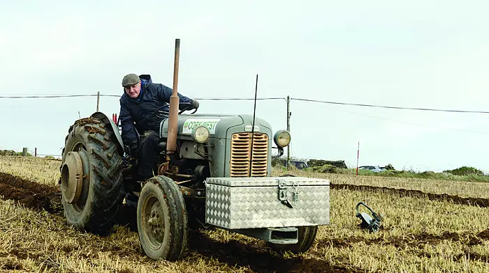 John O’Neill, Ballinadee, ploughing with a Ferguson 35 FE Gold Belly tractor at the De Courcey Classic and Vintage Club members' tillage day in Garrettstown. Above: Robert Shorten, Brendan Nyhan, both Ballinspittle, and William O'Neill, Ballinadee, with identical twin sons Colm and Shane (two and a half years old) at the event. (Photos: David Patterson)