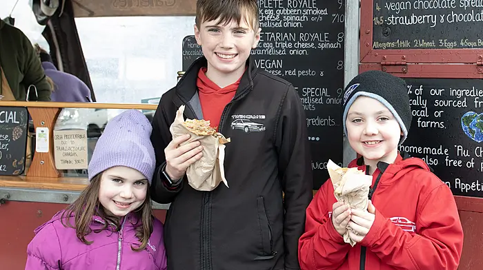Cousins (from left) Grace O'Donovan (Ardfield), Conor McCarthy (Bealad), and Jack O'Donovan (Ardfield), met up at the Friday market in Clonakilty.  (Photo: Martin Walsh)