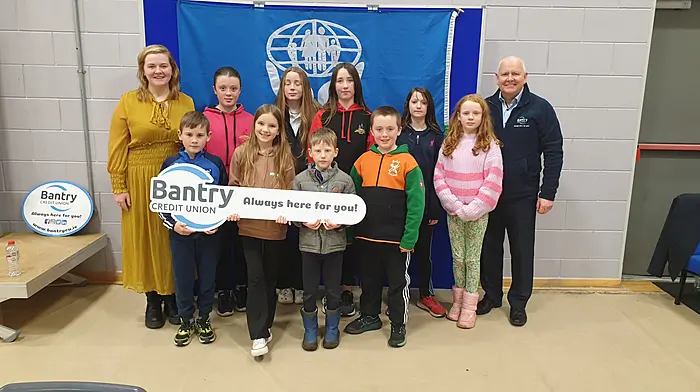 A special shout-out went to the team members and classmates from Scoil Mhichíl Naofa on Bere Island who travelled to Bantry by boat and by car, a round trip of 120km, to take part in the annual Bantry Credit Union Schools Quiz. Back (from left): Abigale Harrington, Feya MacCarthy, Erica Murphy, Meabh Hobbs and Amelia Harrington. Front (from left): Anthony Murphy, Kyla Harrington, Jude Harrington and Cillian Harrington with Fiona Hartnett (school principal) and Finbarr O’Shea (ceo, Bantry Credit Union)