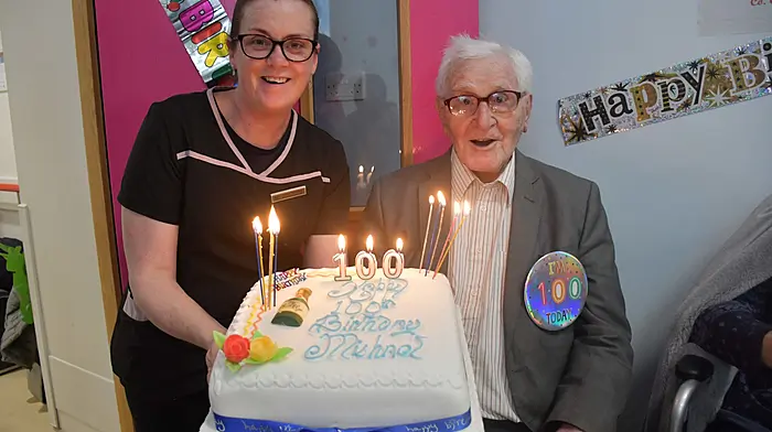 Michael Harnedy, who celebrated his 100th birthday recently, celebrating with Shirley McCarthy, activities co-ordinator at Skibbereen Community Hospital.  (Photo: Anne Minihane)