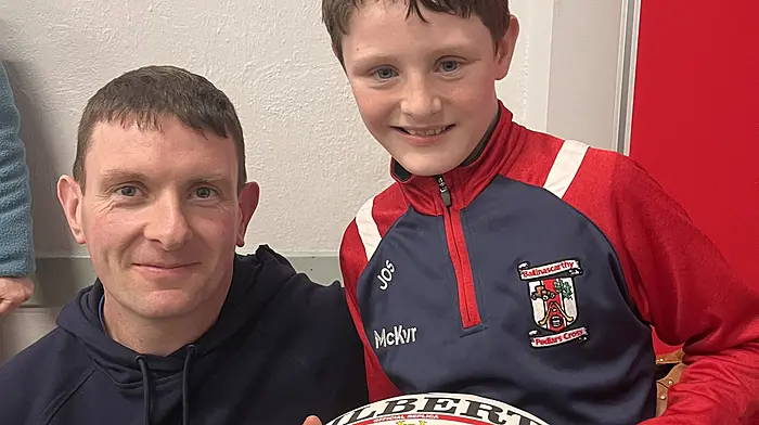 Paul O'Sullivan, a past pupil of Clogagh National School, with his son Jack, a current student in fourth class at the school. Jack won a raffle prize of a signed Munster rugby ball at the fundraising bingo last Sunday.