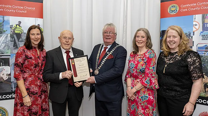 Donal Kelly from Castletownbere receiving his Community Award from county mayor Cllr Joe Carroll at the award ceremony held recently at County Hall in Cork.  Three of Donal’s daughters, Olive, Carmel and Regina accompanied him.   (Photo: Brian Lougheed)